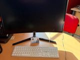 an image of a desk with a computer monitor and keyboard