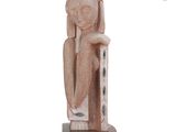 sculpture of a woman sitting on a chair with her hands on her knees
