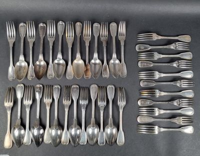 many forks and spoons laid out on a table