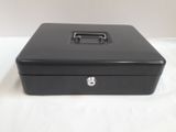 a black metal box with a lock on top of it