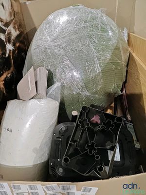 a box full of assorted items in a room