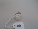 a ring on a string with a price tag attached to it