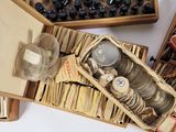 a lot of different items in a box on the table