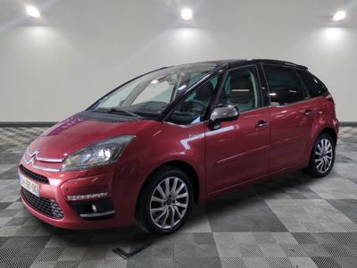 the red citrole is parked on a checkered tile floor
