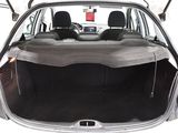 the back of a car with its trunk open and the back seats folded down