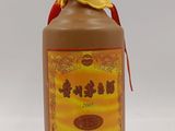 an image of a bottle of hot sauce on a white surface