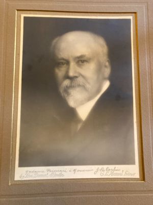 an old photo of a man with a beard and a mustache