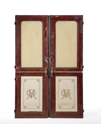 pair of antique wooden doors with chinese writing on them