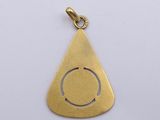 a gold plated triangle shaped pendant with a hole in the middle