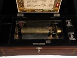 a wooden box with a musical instrument inside of it