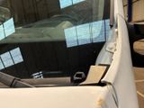 a close up of a car ' s windshield with a sticker on it