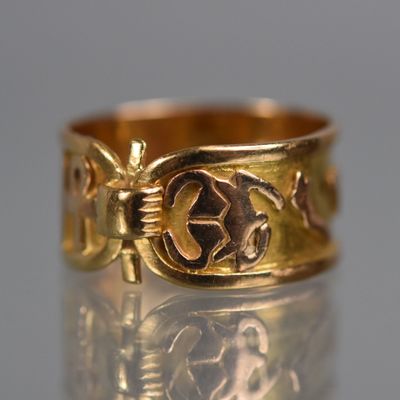 an image of a gold ring with a design on it