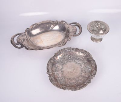 three pieces of silverware are sitting on a white surface