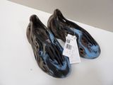 a pair of shoes on a table with a price tag