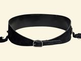 black leather belt with tassels on a white background