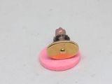 a small mouse that is sitting on top of a pink object