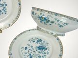 a lot of plates that are sitting on a table