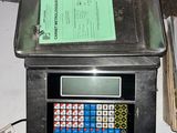 an image of a scale with a calculator on top of it
