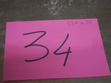a pink piece of paper with the number 34 written on it