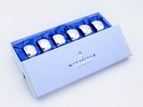 a box that has four pieces of silverware in it