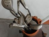 a bag of golf clubs and a bag of golf clubs