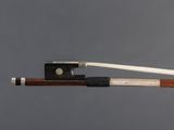 the bow is made of wood and has a white string