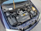 the engine of a car with its hood open and the hood open