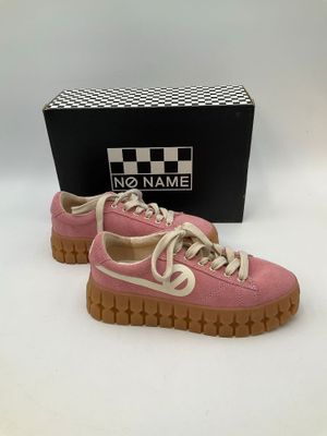 pink and white sneakers with a box in the background