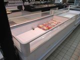 a refrigerated display case in a grocery store