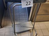 a chair that has a sign on it in a room