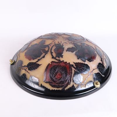 a black and white bowl with a flower design on it