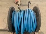 a cart with a bunch of blue hoses on it