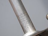 a close up of a sword with a metal handle