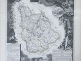 an old map of france in a frame with a picture of a man