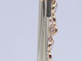 a close up of a pair of scissors with beads on them