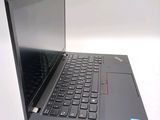 a laptop with a black keyboard on a white surface