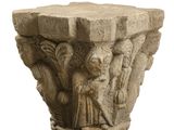 an image of a stone pedestal with carvings on it