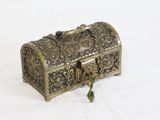 a small metal box with a handle on a white surface