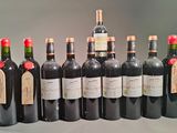 many bottles of wine that are lined up on the table