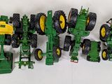 a lot of toy tractors that are lined up together