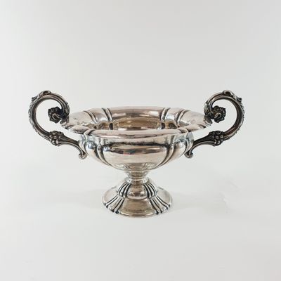 an antique silver plated bowl with handles and handles on a white background