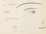un vieux livre sur lequel est dessiné le visage d'une femme