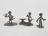 three figurines of a man with a sword and a bowl