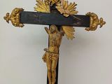 a cross with a crucifix on it on a table