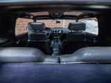 a view of the inside of a car from the back seat