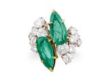 an emerald and diamond cluster ring