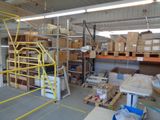 a large warehouse with a lot of boxes on the shelves
