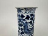 a blue and white vase with a dragon on it