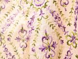 purple and green flowers on a white background with green leaves