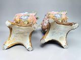 two vases that have been decorated with flowers on them